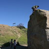 Albert topping out on Boulder 1 as Nathan and Agina watch.