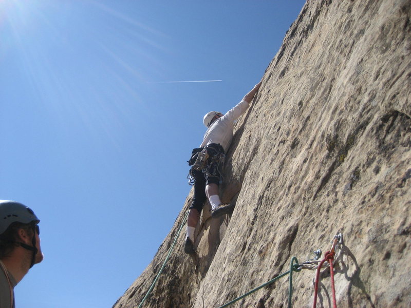 Paul starting the 5.10 section of the 180' second pitch. Photo Pat Moe