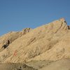 View of the Reefer Madness formation from the pull to Little Spotted Wolf Canyon. A) The More Madness route. The route up to the top of the formation via Reefer Madness is over 1700'