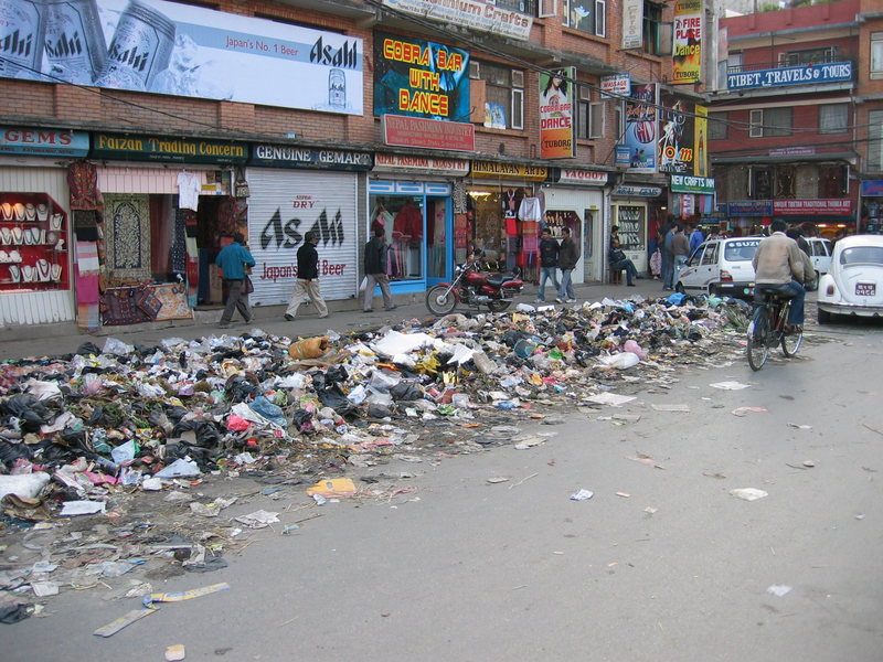 Typical street scene in Kathmandu. Sometimes the trash is collected after it's been picked through by the animals. Other times the piles are burnt in the street in the early hours of the morning.