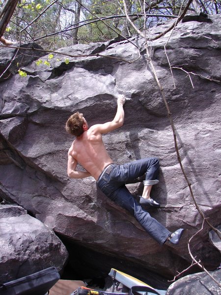 Nic locking off for the crux move.  Cool problem!