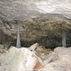 The narrow entrance to spring cave, cool ice stalagmites.