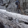 Changing into dry shoes for an early season ascent.