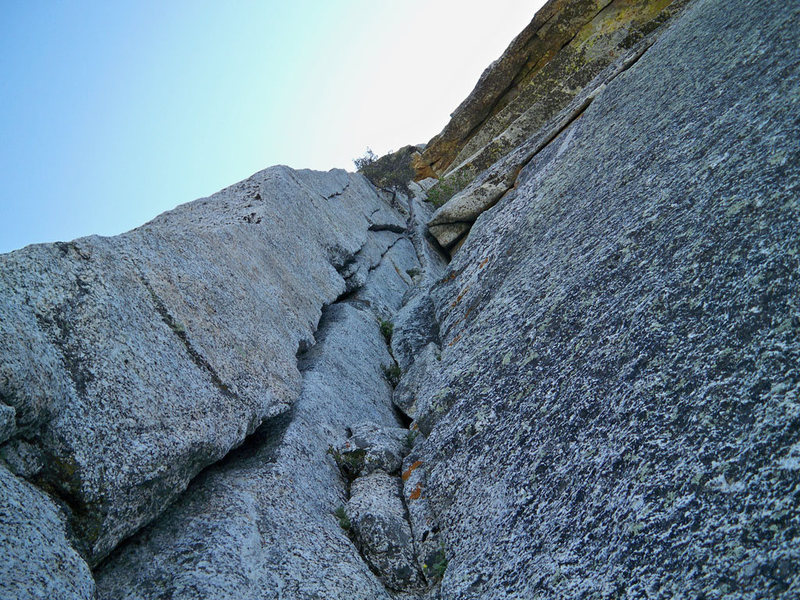 Looking up pitch 1 of The Step.  The crux is the roof seen in the photo.