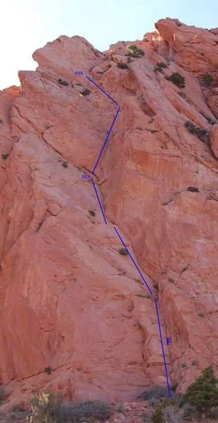 Climb the open book to the right of kingpin.  The first pitch lie backs the slabby dihedral to a 2 bolt anchor. Second pitch is steeper with the crux near the end of the route.  Anchors for second pitch are far left.<br>
2 pitches (120)<br>
F.A. Unknown<br>
