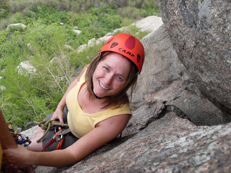 Brenda on the narrow belay ledge at the top of pitch 1.