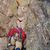 Erik gears up below the cleft chimney.  The pin is halfway up this pitch, below the roof.  Move right at the roof and into the next couloir.  This is P3 and is short.