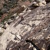 Pleasant slab climbing just below the varnished headwall.