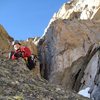 Erik smiling and having fun on the route.  Just below the P3 crux cleft.