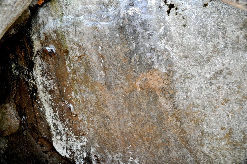 Vag Badger sit starts of the left side in the cave & traverses right to a jug. Flat, angular holds.  Rock is very different from Poppy Cock adjacent to it.