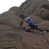 Stepping left to the handcrack after the crux.