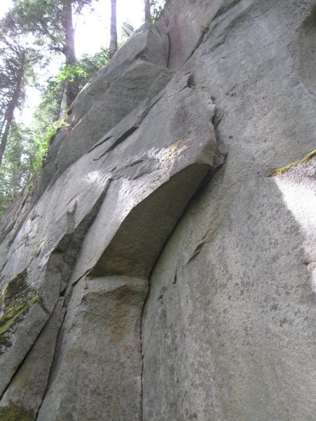 Them (5.9) underclings out the large flake, and then layback and jams up the right side.