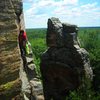 Henning scopes the "Little Rebel Crack" crack mid-route.  Toads?