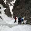 Tackling the water ice step about 1/3 of the way up the couloir.  A second tool is handy here but it's so short and easy that no protection is called for.  It may be possible to avoid the ice with some 3rd class scrambling on skiers right.