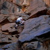 David Daily moving through a world of Basalt on the second ascent of Labor Day.