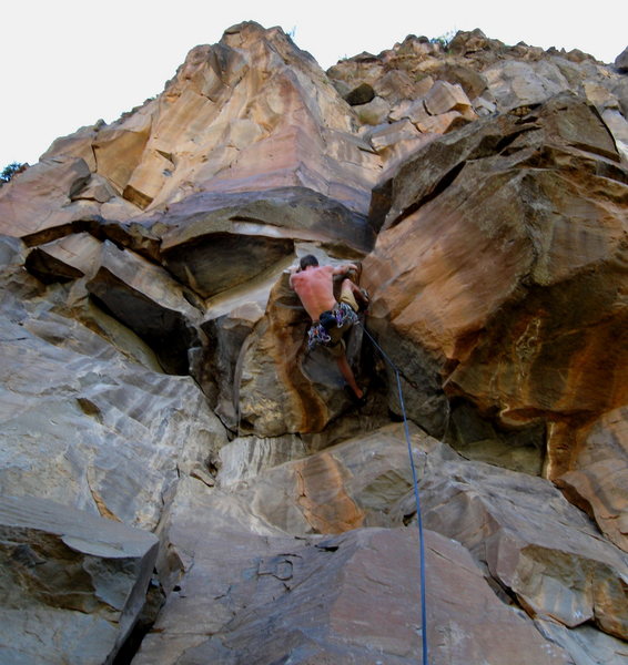 Triple D cranking through the low crux.