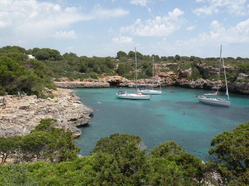 A scenic view of the cove of Cala Sa Nau.  The climbing is found on the unsheltered ocean side behind the photographer.