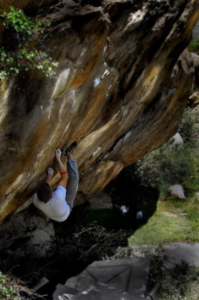 Jason positioning his left hand on the sharp left crimp just before full committal on his F.A. of "The Razor."