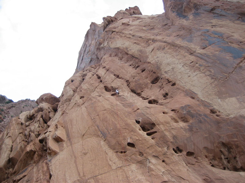 Belay at the top of first pitch . The smooth looking wall below the belayer is the location of The Cats Me-ow 5.10