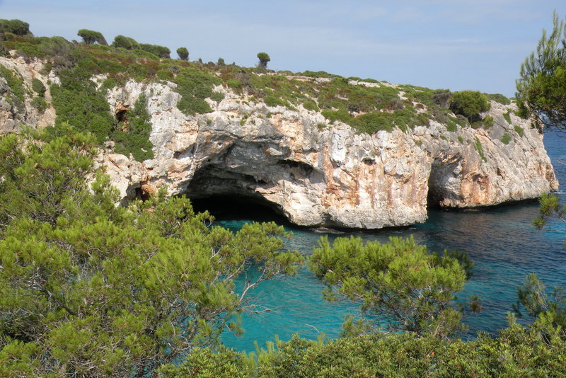 A view of the two caves that form the [[Metrosexual Area]]106481114 (left) and [[Snatch Area]]106481209 (right) at Cala Barques.