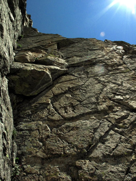 The crux layback crack to the fun face climbing above.  As seen from the fixed belay.  There is an old fixed .5 Camalot protecting the crux.  Not confidence inspiring but plugging more gear would take away a good undercling/jam...pick your poison.