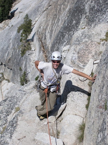 Tristan laughing at the big ledge on pitch two