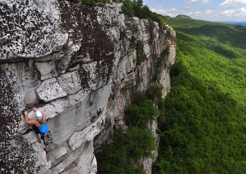 Eve exiting on the 5.6 variation.  The crux 5.9 section is slightly below her and to the right, on the small, clean ledge below the lichen-encrusted bulge.