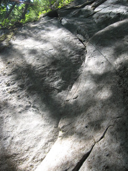 Index Air Force (10a) goes up the right-leaning crack at the bottom (partly hidden), then the crux is the left-leaning crack at the top. 