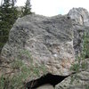 Crossfire, ~V3? Scales this face.  This is located about 30 yds north of the Bierstadt Boulder, on the west side of the trail.  This problem is on the West face, so is not visible from the trail