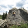 Beginning the crux section of Canvas.  From here, stand up on the left foot, and hit the diagonal rail directly above the climber's head.  Traverse up & right.