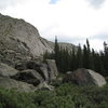 View looking north from near Ben's Arete in the Bierstadt Area.  The pinkish boulder on the right is the Pink Fink Boulder.  The large, black-streaked boulder to the left (in the center of pic) is the Peasants Boulder.<br>
<br>
The Seurat Area is in the forest behind these boulders.