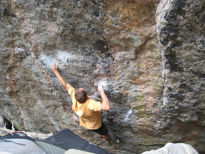 The shouldery crux move of the Dali SDS.  The problem begins matched on the chalked sidepull down & right of the climber's right elbow.