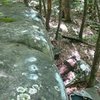 The top out on the warm up boulder