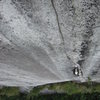 Jon on pitch 6 of the superb piton scarred finger crack.