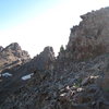 One of the few points where the route heads on to the N side of the NE ridge.  This is only a few minutes walking from the top of the couloir.