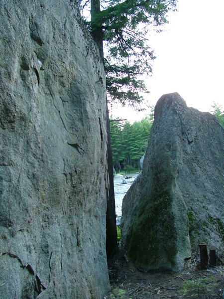 Corridor between boulders right next to Magic Pond. You can see the pond through the gap in the rocks