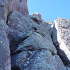 Looking up the class 5.3 summit pitch.  The crux is in the first ~12 feet (Aug. 1, 2009).