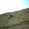 Katie climbing up Stout Blue Vein at Jurassic Park.