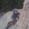 Scotty on the pillar before the arete.