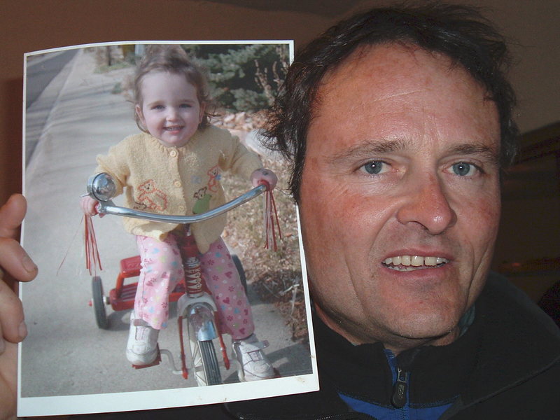 Craig with his daughter, Guilia's picture.  Craig always put up pictures of her all around his bed when he traveled.  He missed her so.