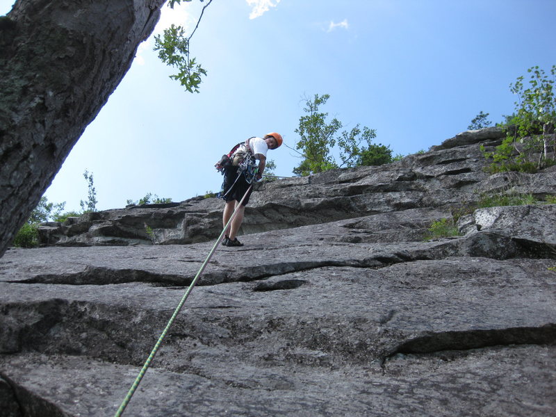 Ryan rappelling down from the top of the third pitch. The third pitch ascends to the right of him at the small birch tree in the overlaps.