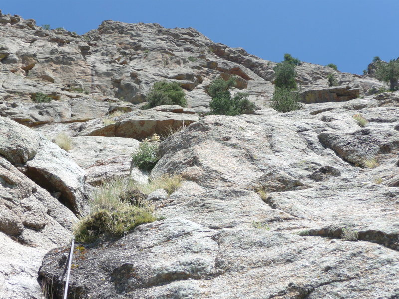 Looking up the start of Pitch 3 which ends at the first large trees.