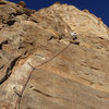 On the FA of the first pitch on what is probably the easiest route thus far (5.7 or 5.9) at The Bat Cave.  Once things cool off this line will continue to the top of this cliff.