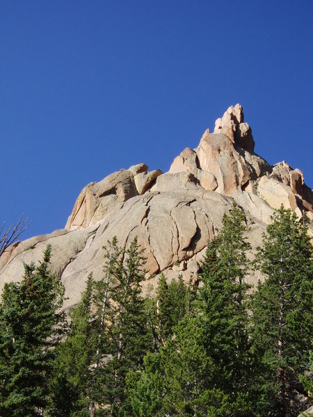 A view of the face from the descent trail. The Center route is the far left crack on the main slab shown here.