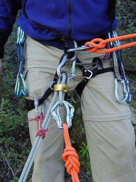 This is the setup that I routinely use when I have built a top-rope anchor that is extended some distance over an edge and I need to rappel that route.  I, in effect, rappel a separate strand of rope (using the munter) to get to the extended masterpoint.  I pre-rig the rappel on the actual climbing rope, before I begin descending with the munter.