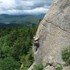 Climber works her way up Rock of Ages.