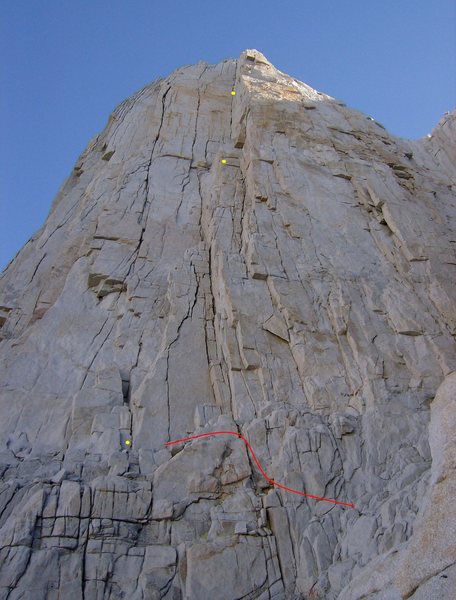 29aug09, we did it like this.  Red line denotes our approach to 4th class ledge, three yellow dots show our belays, pitches.  Second belay station (at 2nd dot) out of view at base of dihedral corner.<br>
<br>
Check out the distorting effect of the photo:  Second pitch (200') is actually almost as long as first pitch (215')!