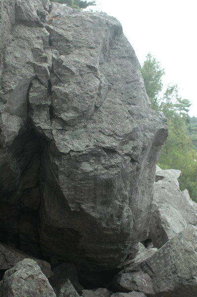 Group Leader climbs up the steep prow.