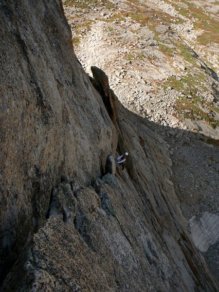 A German climber finishing the crux pitch of Syke's Sickle.