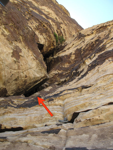 Pitch 6 traverses left from the piton anchor. Note the pod and dirty gully above - don't climb that!